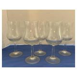 Five clear glass wine goblets