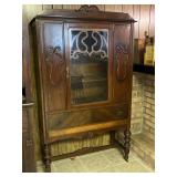 Vintage China closet, has beautiful scroll work.