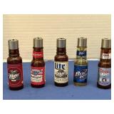 Five collectible novelty beer bottled shaped