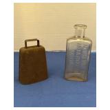 Vintage metal cowbell and antique clear glass