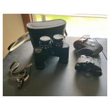 Two sets of binoculars with cases.  Commander,