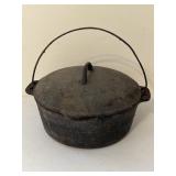 Vintage cast-iron Dutch oven or cauldron with