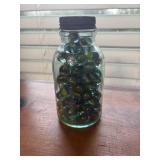 Vintage bottle full of cat eyes marbles