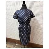 vintage dress features a classic navy blue and