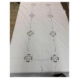 vintage-style white tablecloth features intricate
