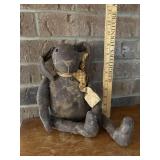 primitive fabric bunny doll featuring an aged,