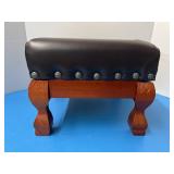 Small, wooden, upholstered footstool
