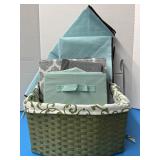 Green woven basket full of storage canvas boxes