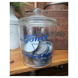 Vintage Toms Jar has a crack pictured filled with