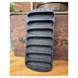 Vintage cast-iron cornbread pan marked on back