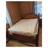 Full/Queen wooden spindle post bed frame with a