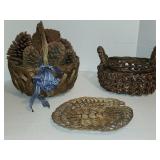 Two dark brown woven wicker baskets with oval
