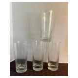 Clear, tall, drinking glass with vertical paneled