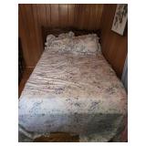 Full Size bed with vintage floral patterned