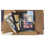 Worldwide Stamps on pages in large flat rate box,