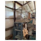 Two bird cages, folding lawn chairs, all contents on shelf