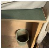 Lower cabinet with paint, jumper cables, miscellaneous herbicides, and hand drills