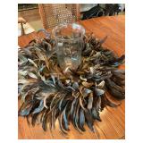 Glass vase with unique feather wreath