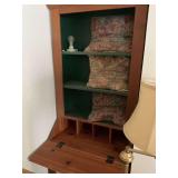 Desk with floor lamp and box fan