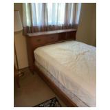 Twin bed with headboard and mattresses