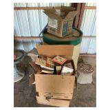 Plastic barrel, boxes of books, roofing screws and birdbath