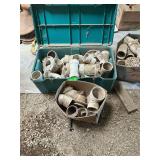 Lot with miscellaneous plumbing supplies, including teal tote