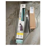 Shower rod, white flags, floor scraper and floor mat