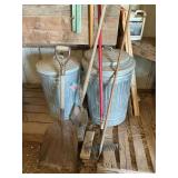 Metal trash cans and assorted hand tools