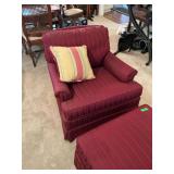 Burgundy stuffed chair with ottoman