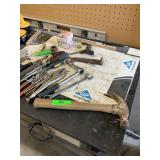 Miscellaneous hand tools on top of workbench