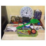 Household Items Including Clock, Camera, and Hand Tools