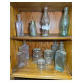 Collection of Clear Glass Bottles and Jars