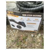 Mini skid steer backhoe