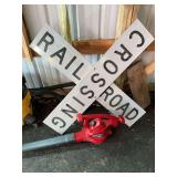 Railroad crossing sign, leaf blower and shop vac