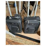 Lot of two matching carry-on suitcases