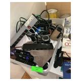 Lot with assorted cords and remotes, books, and flashlight