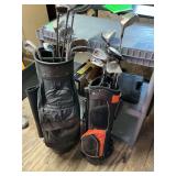 Lot of golf clubs and two bags