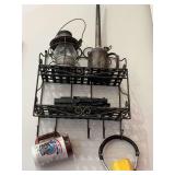 Lantern, oiler and model train on shelf