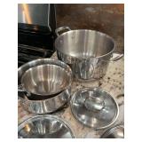 Stainless steel cooking pots and pans