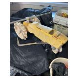 Lawn sprinkler, grease gun, trimmer line, shade cloth, and assorted items