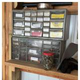 Storage unit with drawers and contents on wall