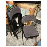 Lot of four padded metal folding chairs