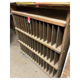 Roll around cabinet with 48 cubby holes and 1 open top shelf