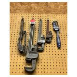 1 Diamond chain wrench, 1 Fuller 24 inch aluminum pipe wrench, 4 other pipe wrenches