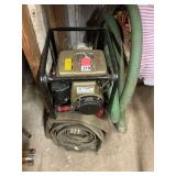 Wisconsin 1-1/2 inch water pump with 25 feet of suction and 25 feet of discharge hose