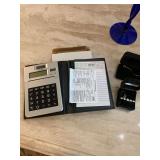 Blue goblets, clutch purses, bracelets, calculator