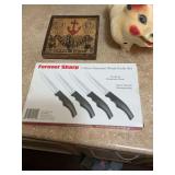 Steak knives, vintage piggy bank, and decor