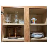 Two shelves of assorted glassware