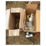 Assorted salt and pepper shakers, wine bottle stoppers, and butter dish