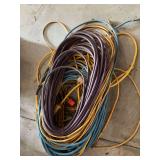 Pile of partial extension cords used for repair or scrap